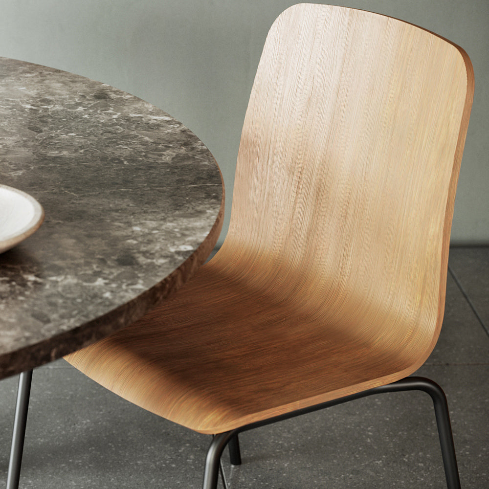 Morro Dining Chair by Kollektiff, showing closeup view of morro dining chair with table in live shot.