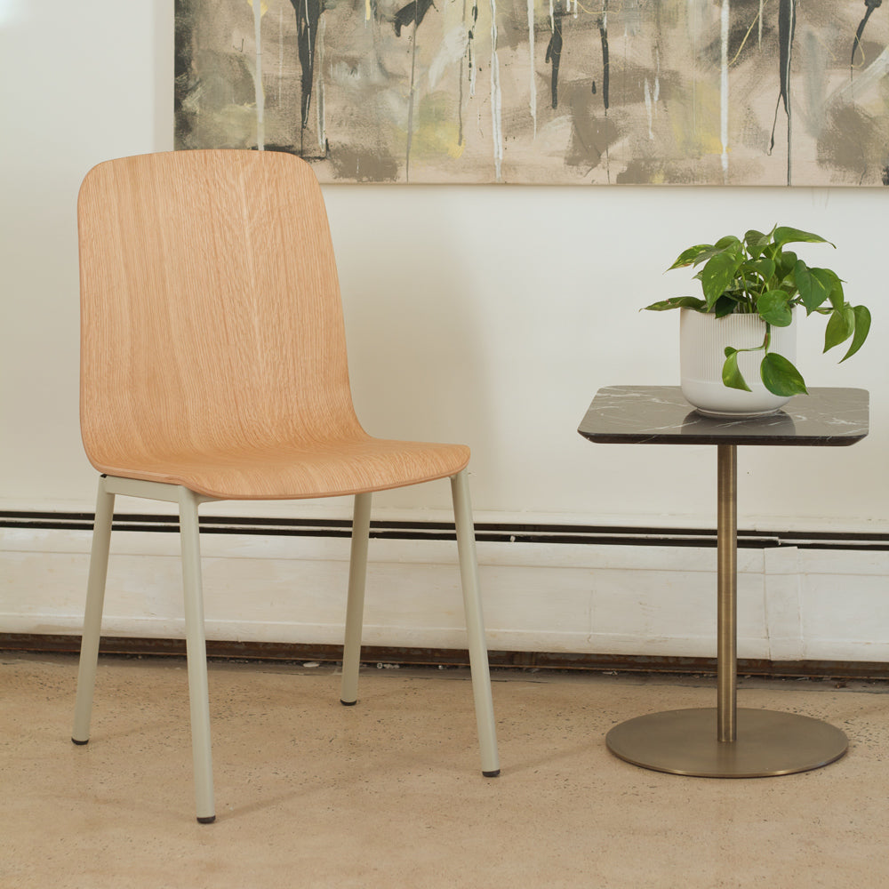 Morro Dining Chair by Kollektiff, showing morro dining chair with table in live shot.