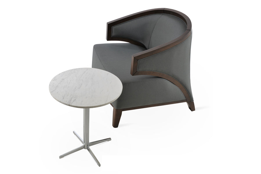 Mostar Arm Chair by SohoConcept, showing arm chair with table.