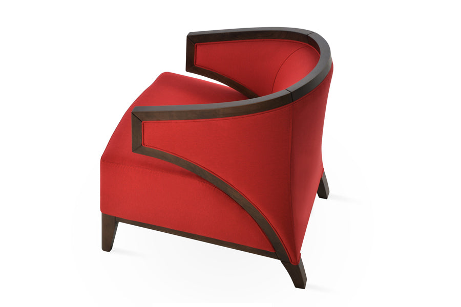 Mostar Arm Chair by SohoConcept, showing back angle view of arm chair with table.
