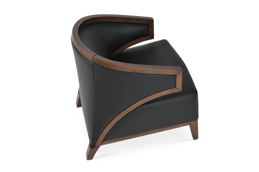 Mostar Arm Chair by SohoConcept, showing back angle view of arm chair with table.