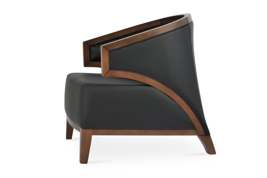 Mostar Arm Chair by SohoConcept, showing side view of arm chair with table.