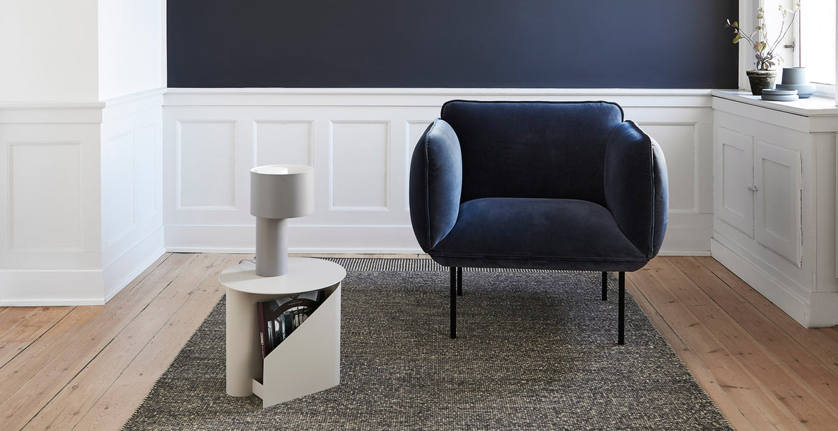 Nakki Armchair by Woud, showing nakki armchair in live shot.