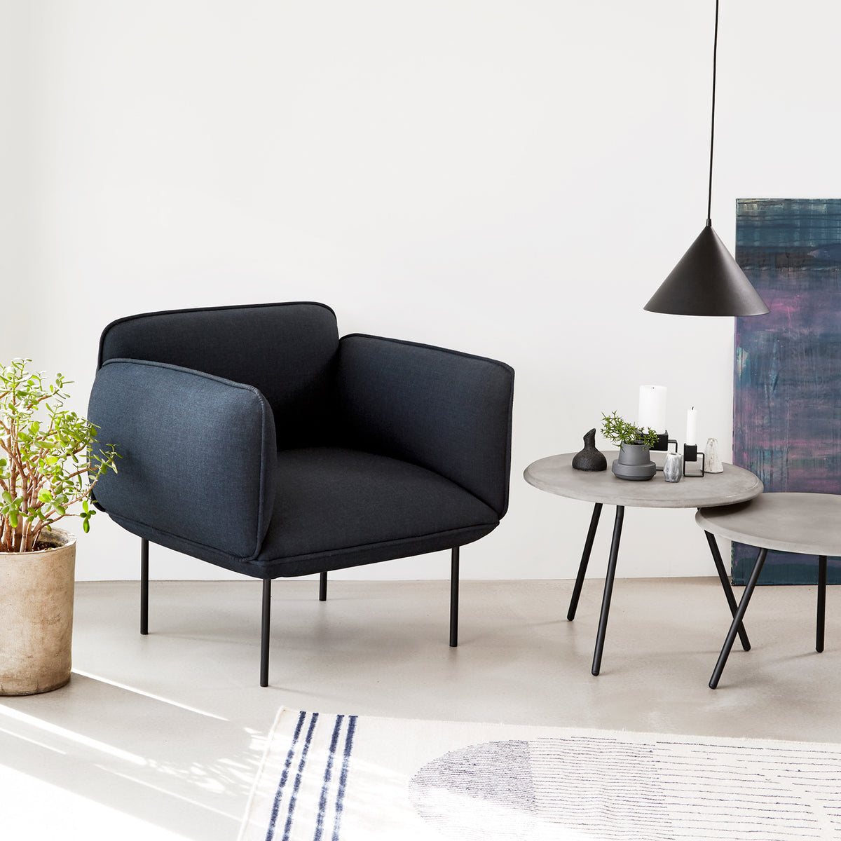 Nakki Armchair by Woud, showing nakki armchair in live shot.