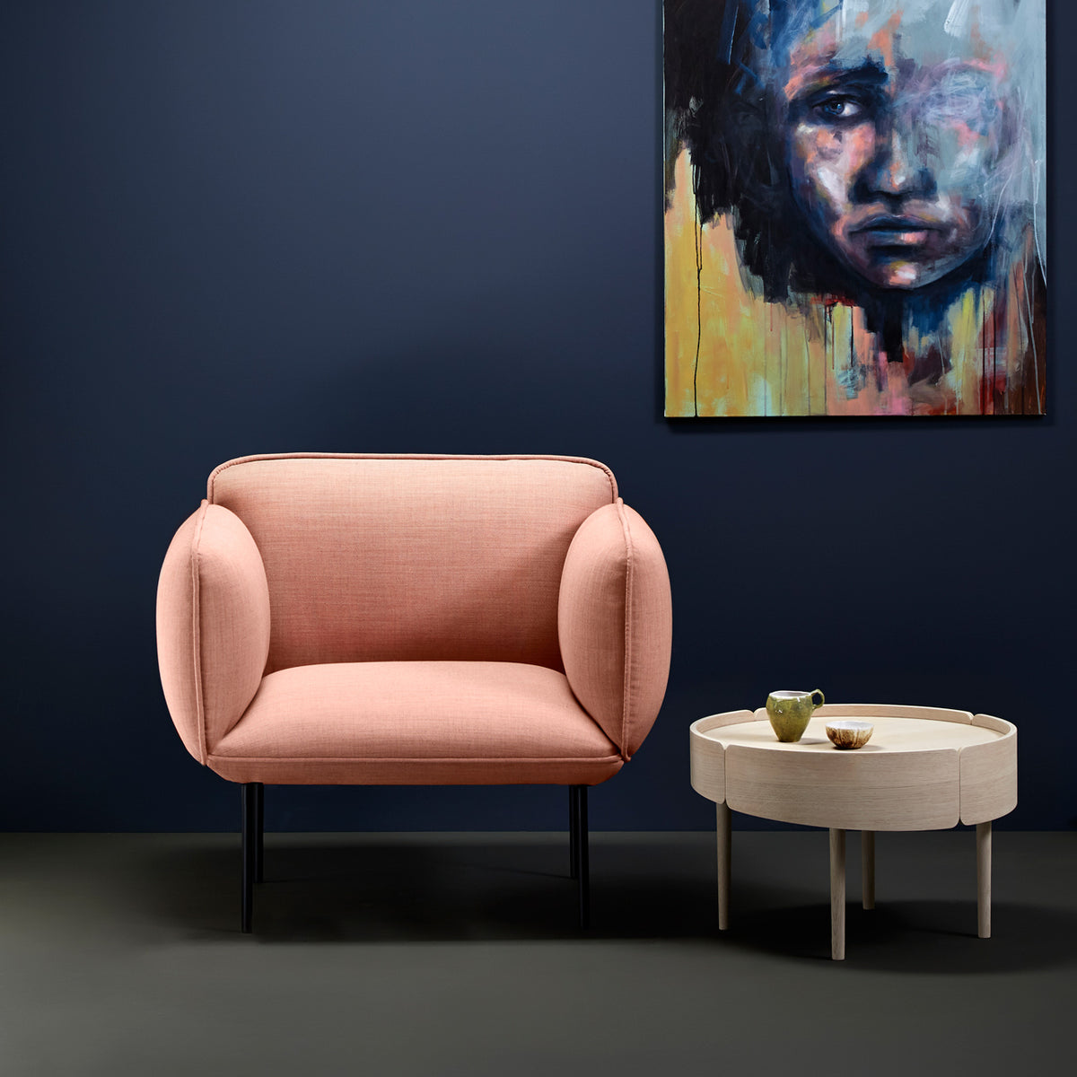 Nakki Armchair by Woud, showing nakki armchair in live shot.