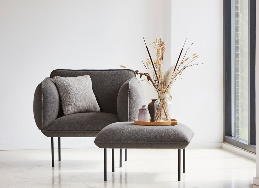 Nakki Armchair by Woud, showing nakki armchair in live shot.