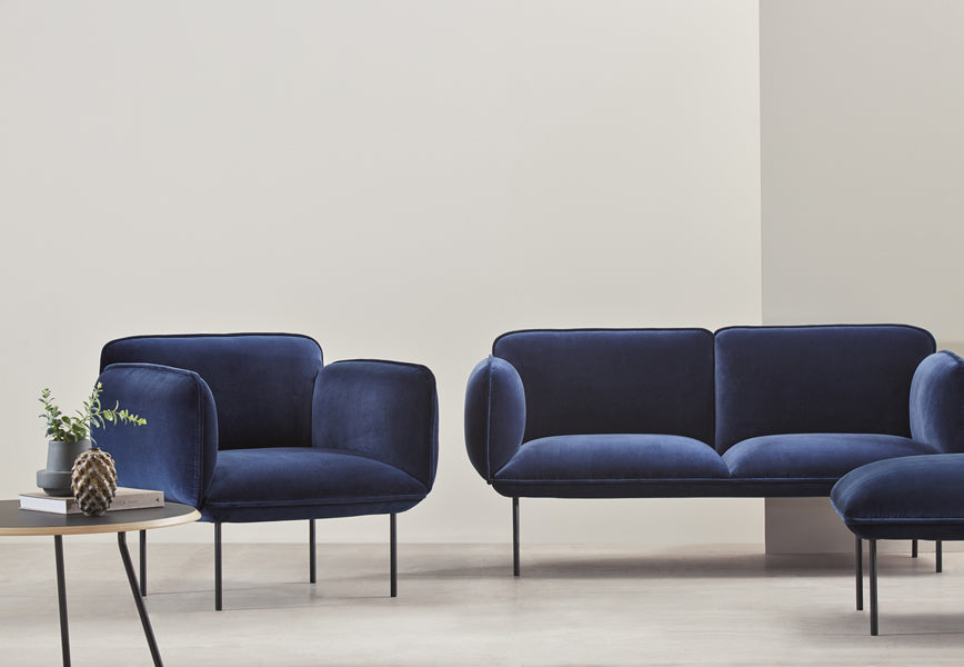 Nakki Armchair by Woud, showing nakki armchair in live shot.