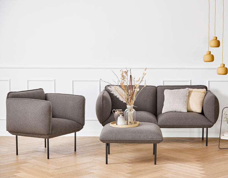 Nakki Armchair by Woud, showing nakki armchair in live shot.