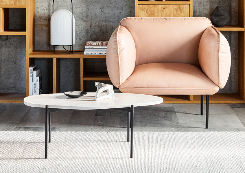 Nakki Armchair by Woud, showing nakki armchair in live shot.