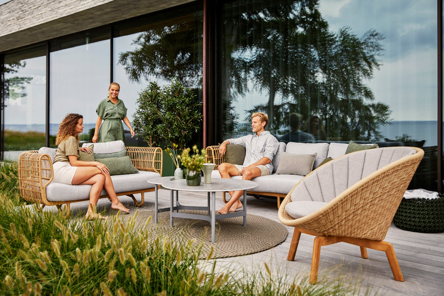 Nest Outdoor Sofa by Cane-Line, showing nest outdoor sofa in the live shot.