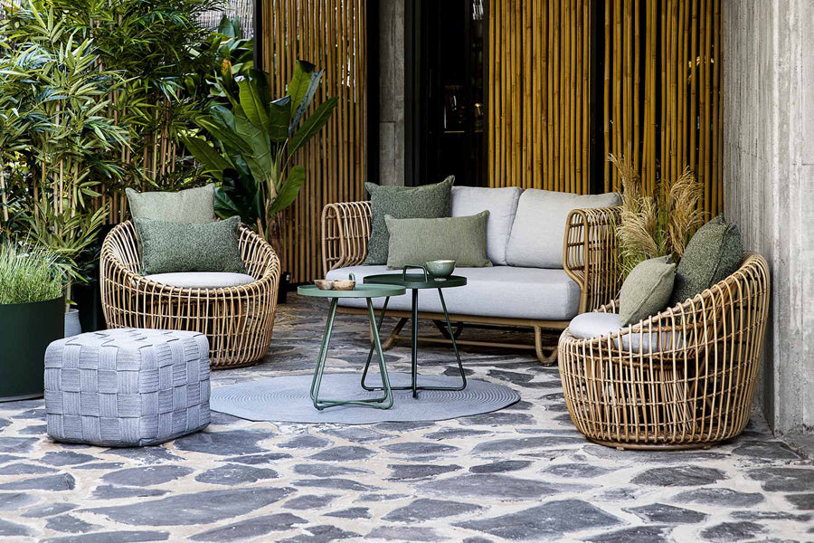 Nest Outdoor Sofa by Cane-Line, showing nest outdoor sofa in the live shot.