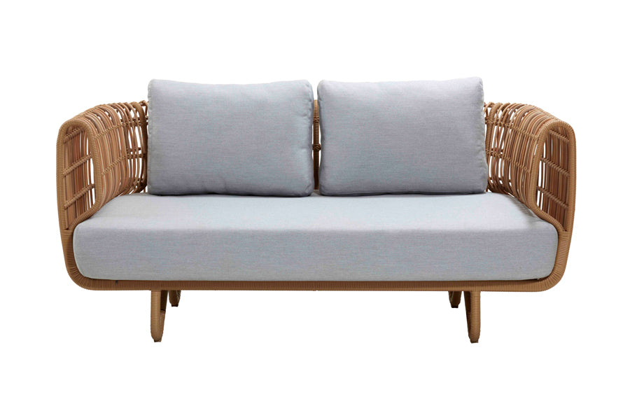 Nest Outdoor Sofa by Cane-Line, showing front view of nest outdoor sofa in natural frame/light grey cushion.