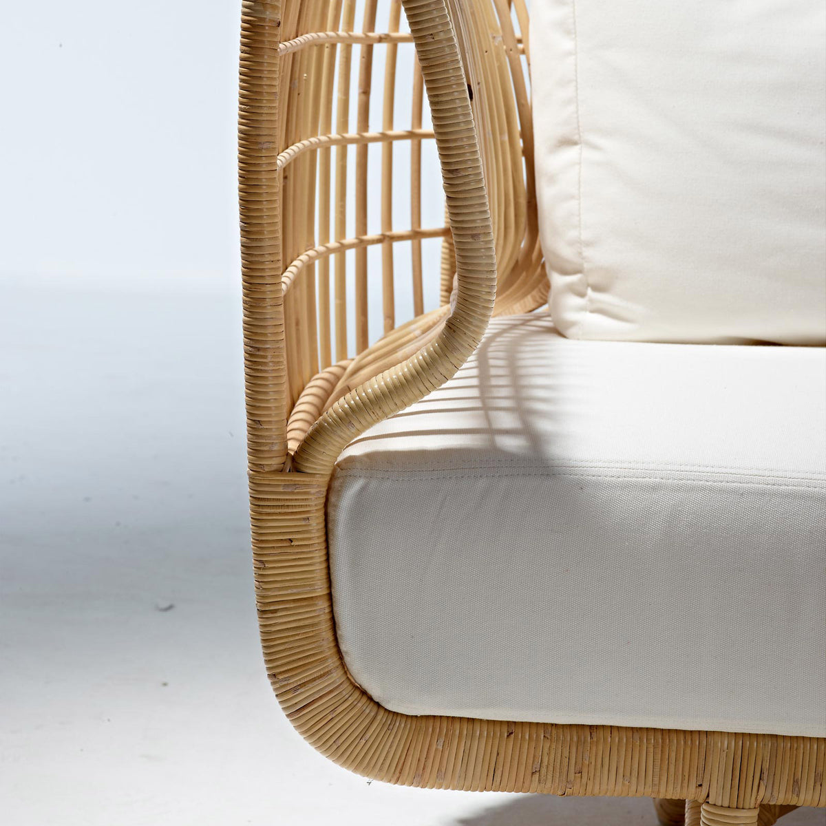 Nest Indoor Sofa by Cane-Line, showing closeup view of nest indoor sofa in live shot.