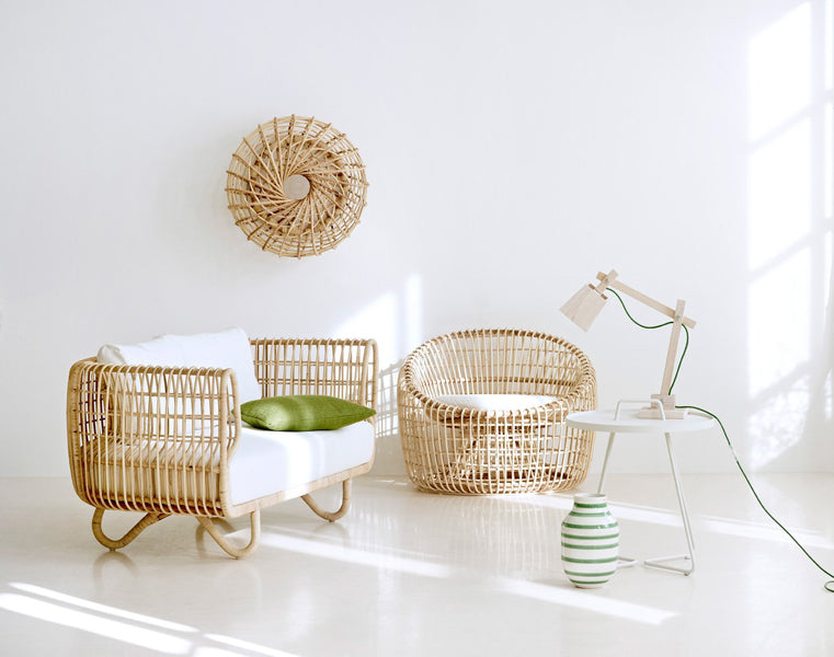 Nest Indoor Sofa by Cane-Line, showing nest indoor sofa with chair in live shot.