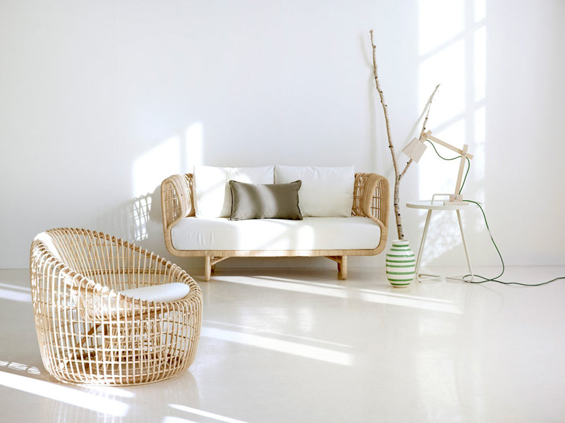 Nest Indoor Sofa by Cane-Line, showing nest indoor sofa with chair in live shot.