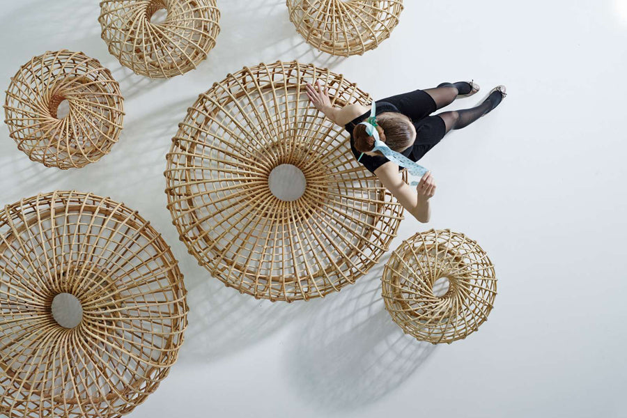 Nest Indoor Coffee Table/Footstool by Cane-Line, showing nest indoor coffee table/footstools in live shot.