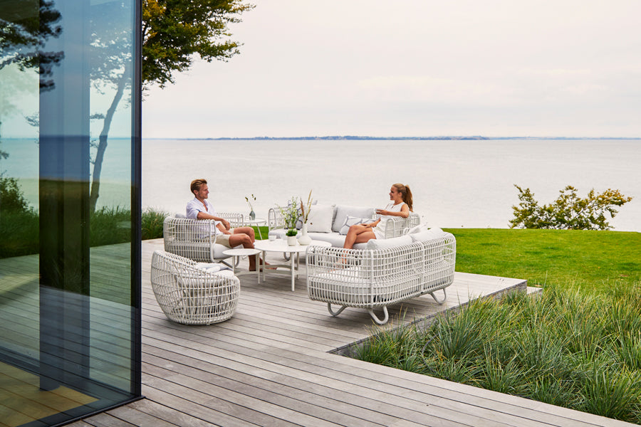 Nest Outdoor Lounge Chair by Cane-Line, showing nest outdoor lounge chair in the live shot.