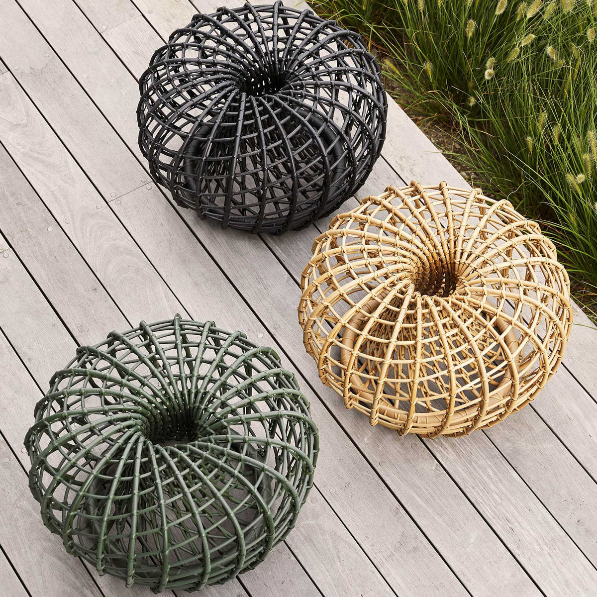Nest Outdoor Footstool/Coffee Table by Cane-Line, showing nest outdoor footstool/coffee table in live shot.
