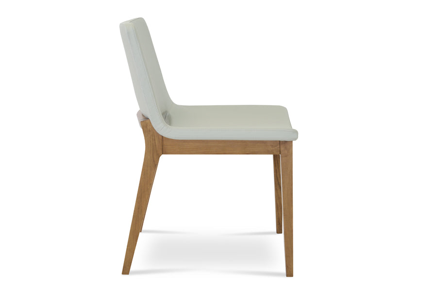 Nevada Wood Chair by SohoConcept, showing angle view of navada wood chair in light grey leatherette with beech walnut wood base.