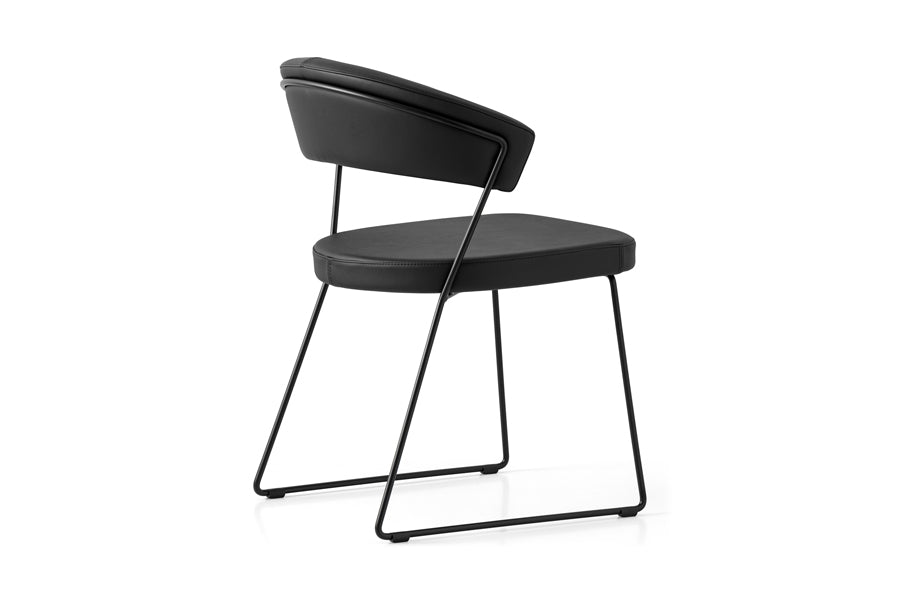 New York Chair by Connubia, showing back view of new york chair in matt black metal frame + black soft leather seat.