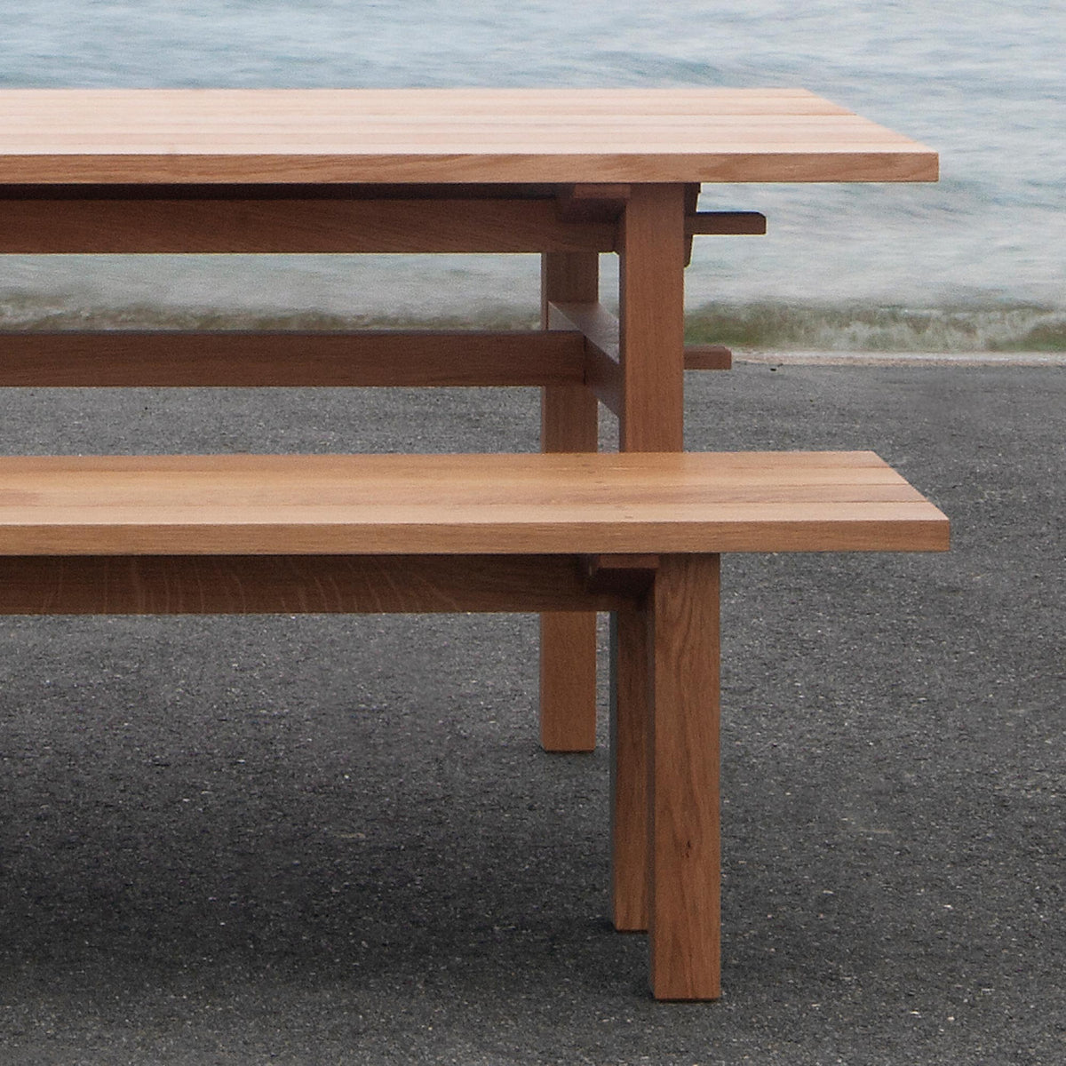 Arkipelago KVP10 Table by Nikari, showing detail view of arkipelago kvp10 table with bench in live shot.