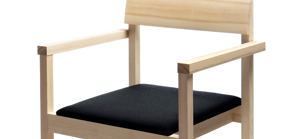 Arkitecture KVT8 Chair with Armrests by Nikari, showing closeup view of arkitecture kvt8 chair with armrests in ash, fabric 2: steelcut trio by kvadrat.