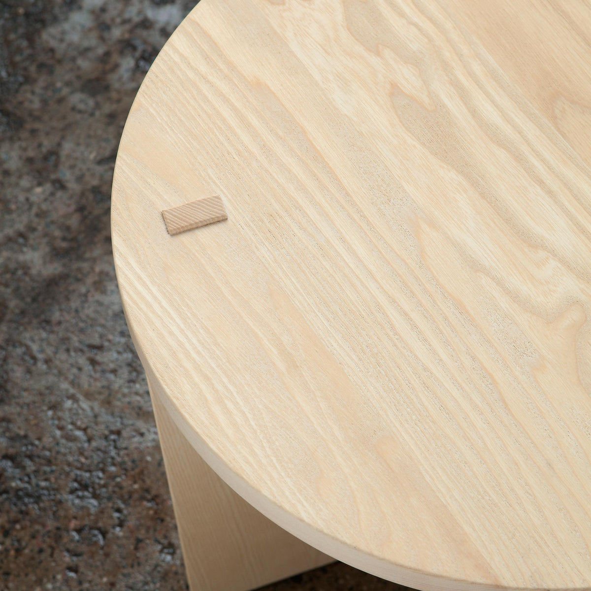 Arte Marfa Stool Table by Nikari, showing top detail view of arte marfa stool table in live shot.