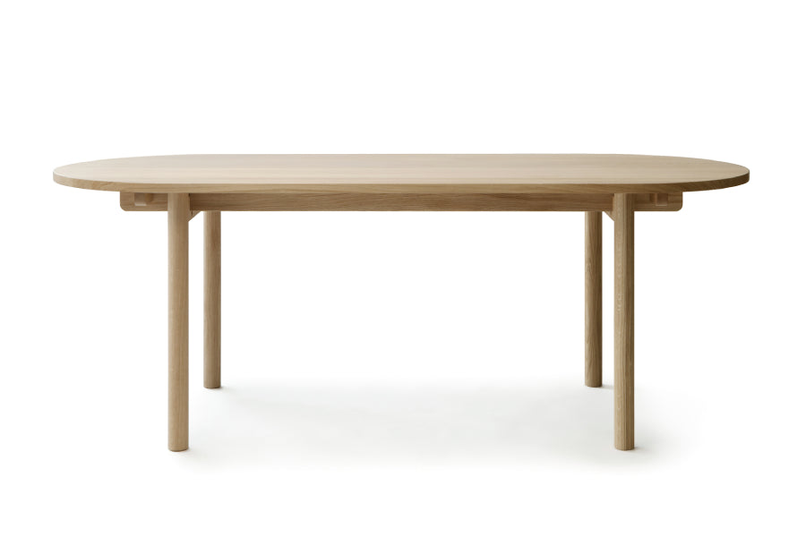 Basic Table by Nikari, showing front view of oval basic table in oak.