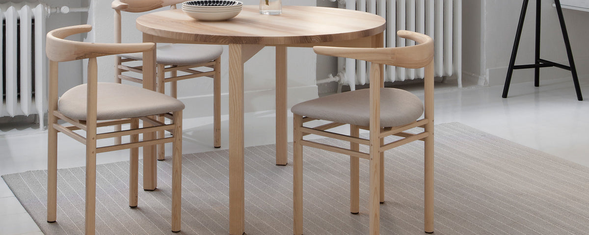 Periferia Dining Table by Nikari, showing closeup view of periferia dining table in live shot.