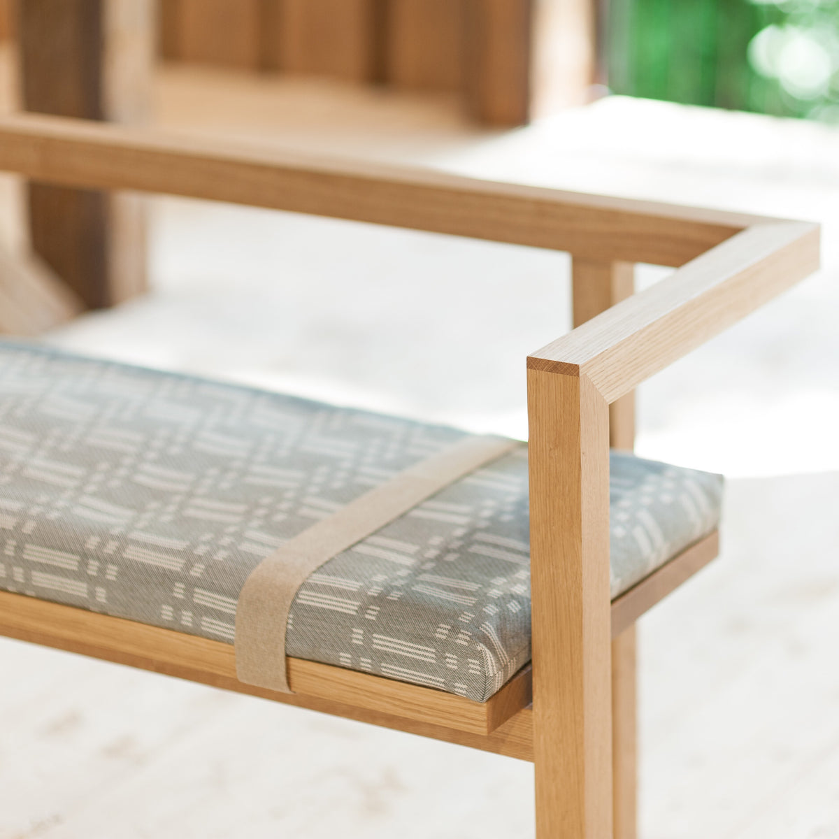 Storia Konstruktio Bench by Nikari, showing detail view of storia konstruktio bench with seat pad in live shot.