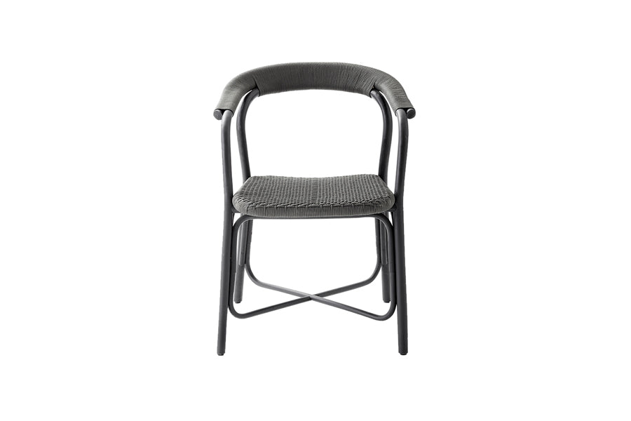 Noble Indoor Armchair by Cane-Line, showing front view of noble indoor arm chair in black rattan/aluminum.