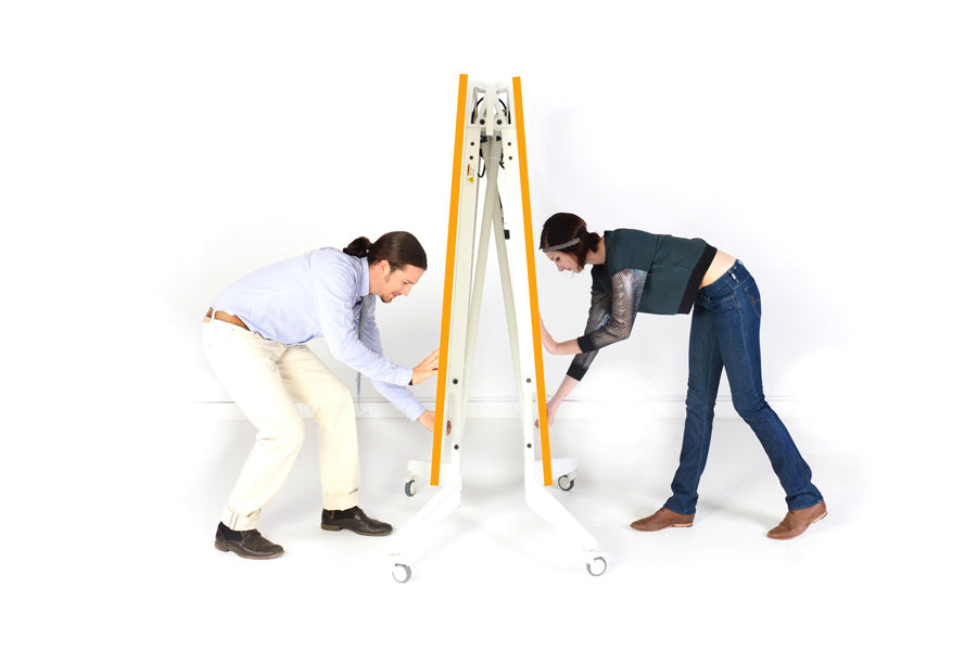 Nomad Folding 9FT Sport Conference/Markerboard/Ping Pong Table by Scale 1:1, showing folded side view of nomad folding 9ft sport conference/markerboard/ping pong table in white/tangerine.