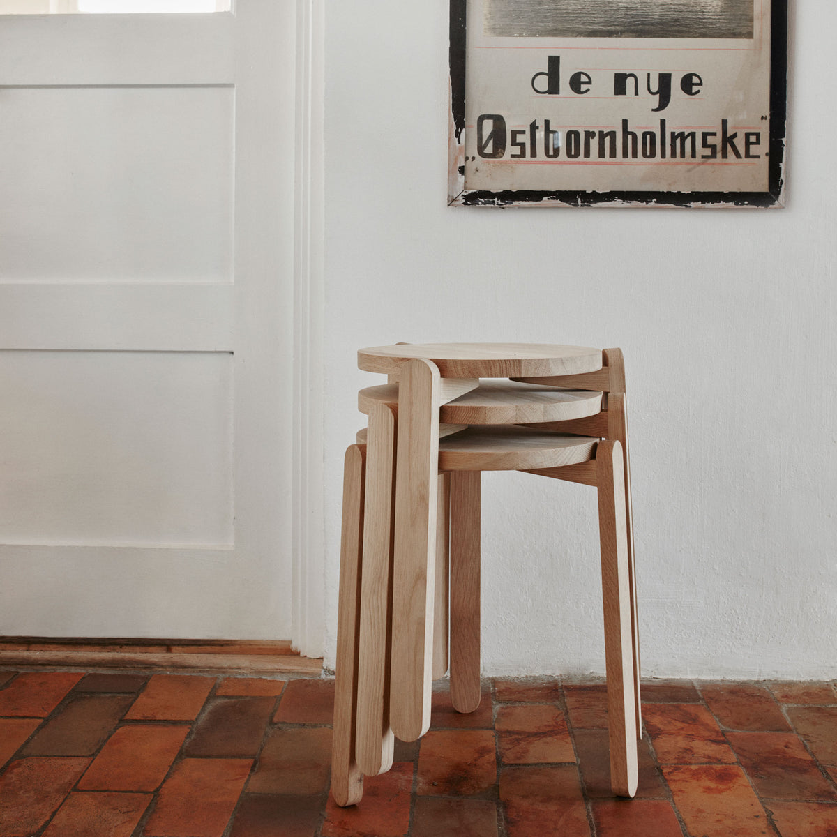 Nomad Stool by Skagerak, showing nomad stools in live shot.
