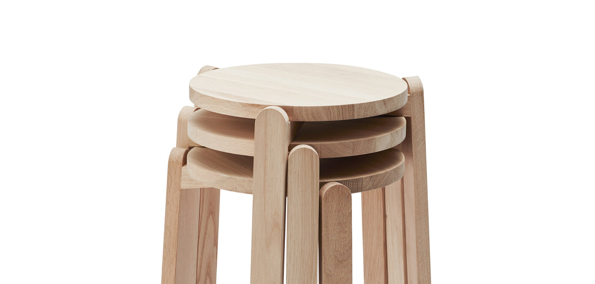 Nomad Stool by Skagerak, showing top view of nomad stools in natural oak wood.