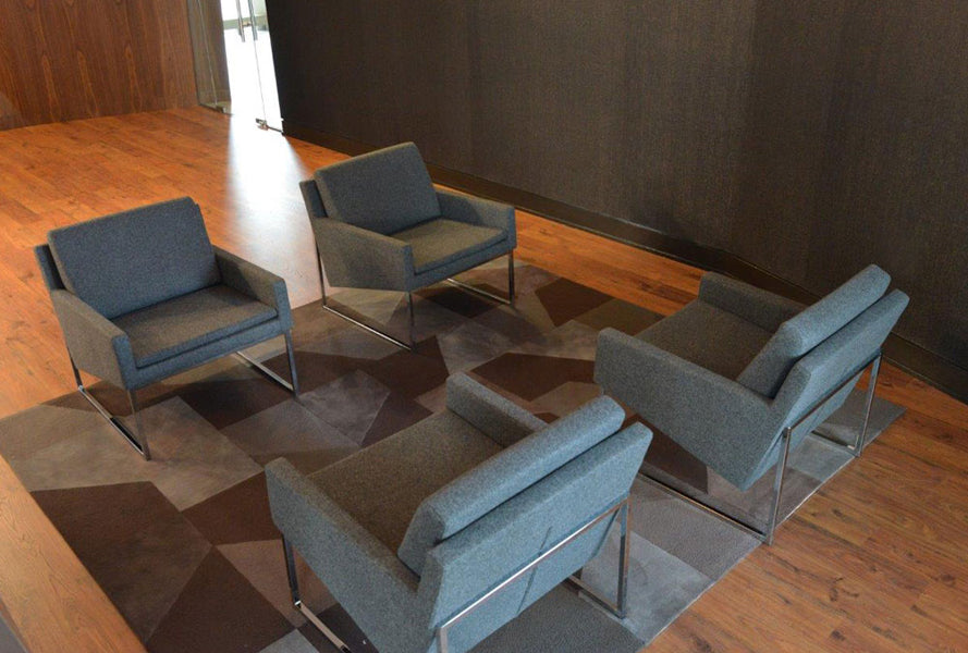 Nova Sled Armchair by SohoConcept, showing four nova sled armchairs in live shot.
