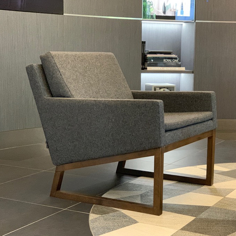 Nova Wood Arm Chair by SohoConcept, showing angle view of wood arm chair in live shot.