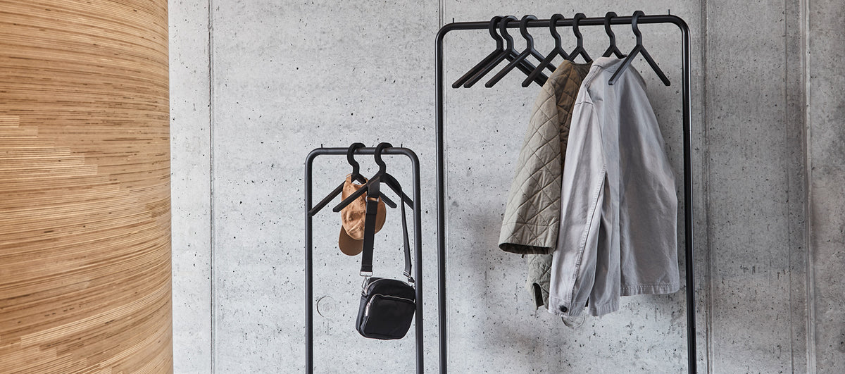 O&O Clothes Rack by Woud, showing closeup view of o&o clothes racks in live shot.