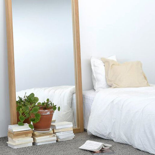 Light Frame Floor Mirror by Ethnicraft, showing closeup view of oak light frame floor mirror in live shot.