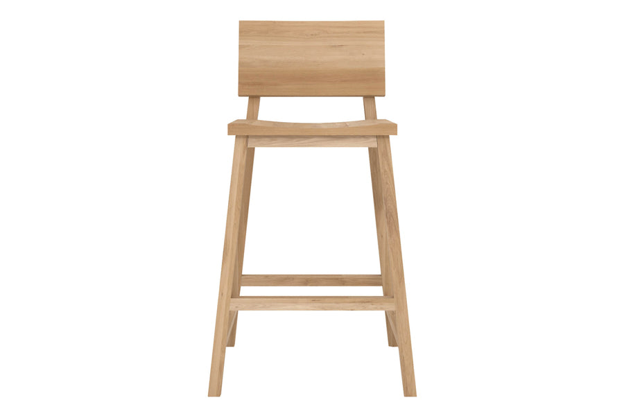 N3 Counter Stool by Ethnicraft, showing front view of n3 kitchen counter stool in oak.