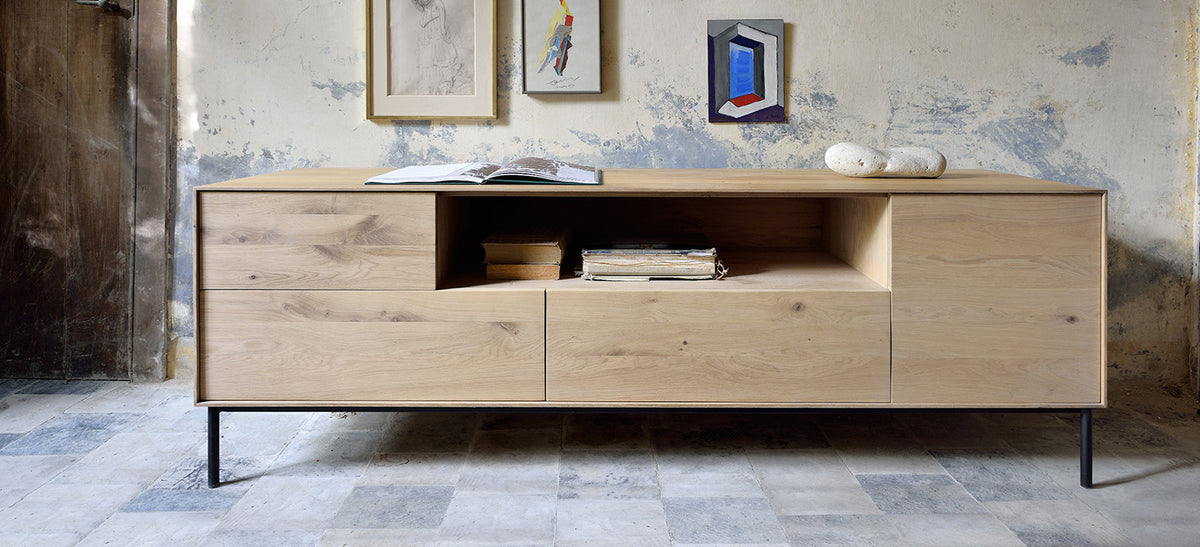 Whitebird TV Cupboard by Ethnicraft, showing front view of oak tv cupboard in live shot.