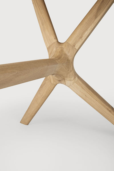 X Dining Table by Ethnicraft, showing closeup view of oak x dining table in oak wood.