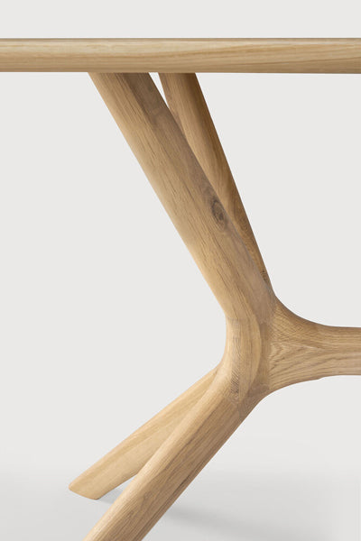 X Dining Table by Ethnicraft, showing closeup view of oak x dining table in oak wood.