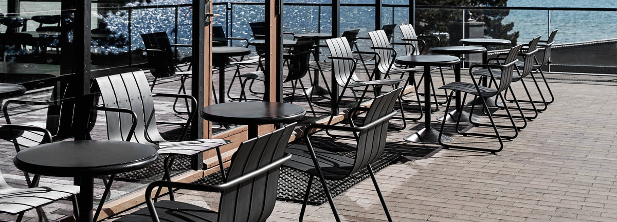 Ocean Dining Chair by Mater, showing ocean dining chairs with tables in live shot.