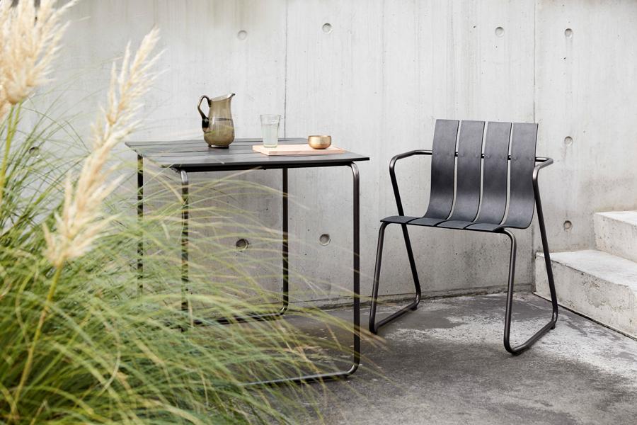 Ocean Dining Chair by Mater, showing ocean dining chair with table in live shot.