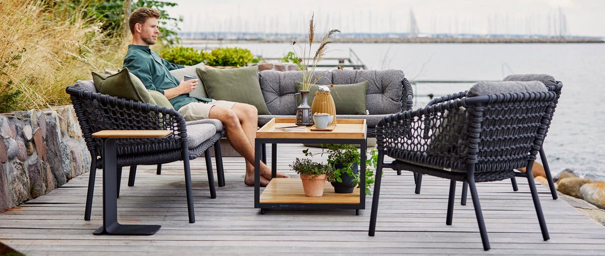 Ocean Outdoor Lounge Chair by Cane-Line, showing ocean outdoor lounge chairs in live shot.