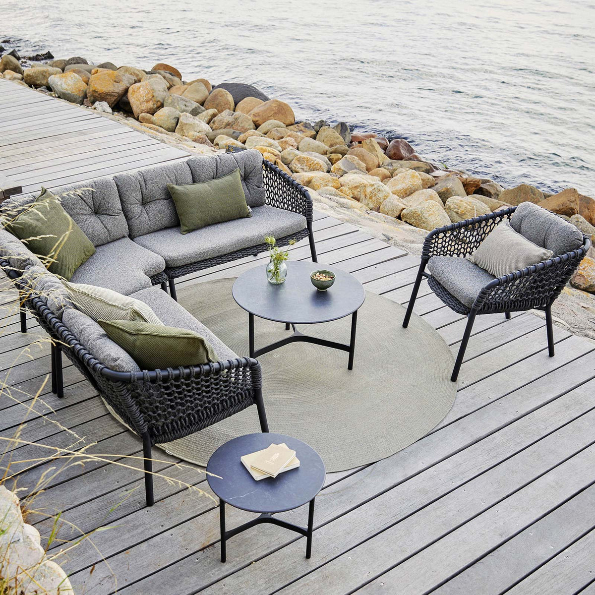 Ocean Outdoor Lounge Chair by Cane-Line, showing ocean outdoor lounge chair in live shot.