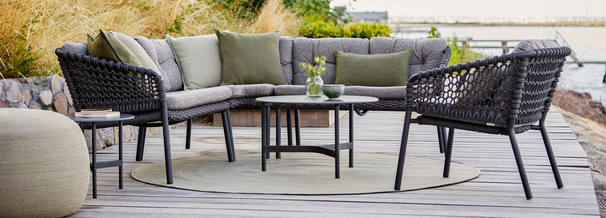Ocean Outdoor Lounge Chair by Cane-Line, showing ocean outdoor lounge chair in live shot.