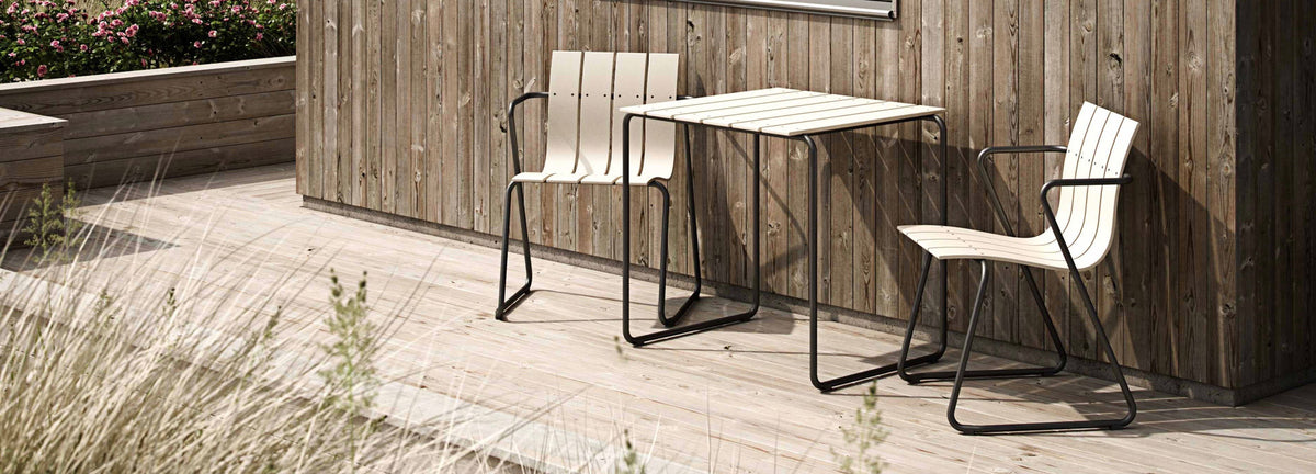 Ocean Table by Mater, showing ocean table with chairs in live shot.