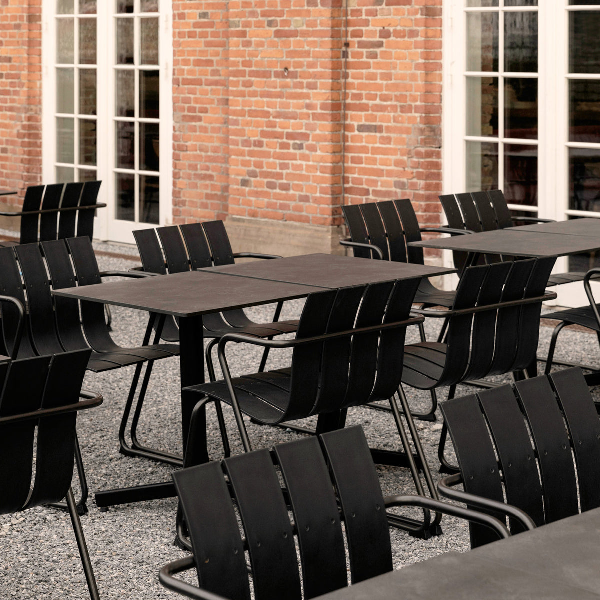 Ocean Table by Mater, showing ocean tables with chairs in live shot.