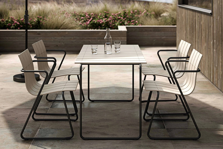 Ocean Table by Mater, showing ocean table with chairs in live shot.